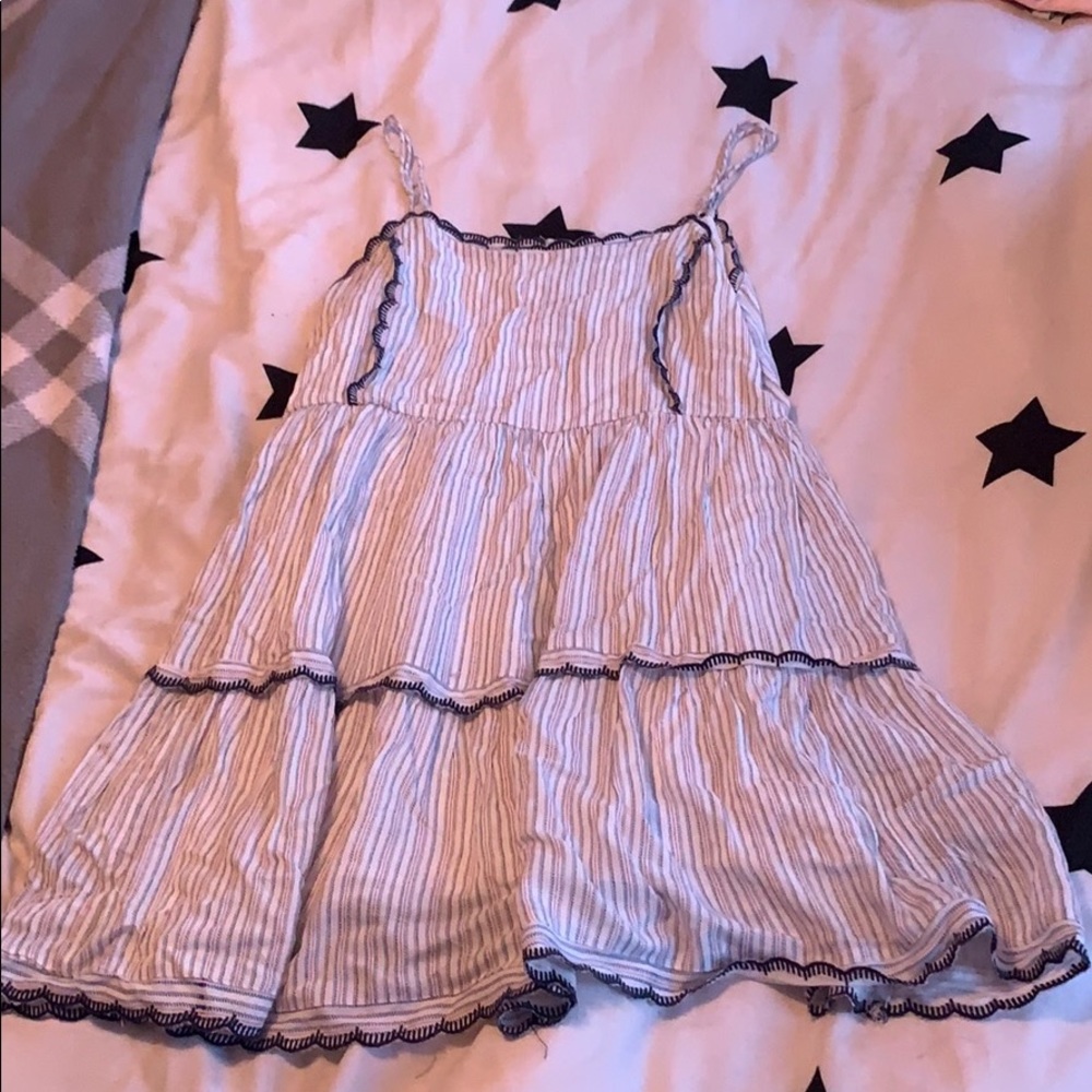 white lose fitting dress with adjustable straps